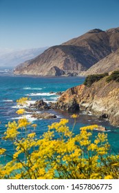 Scenic View Of Beautiful California Central Coast On A Sunny Day With Blue Sky And Coastal Fog In Big Sur, California, Western USA