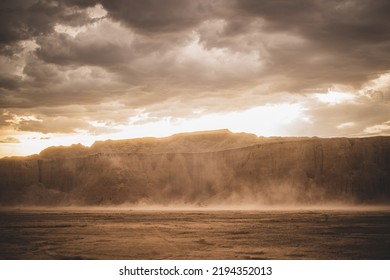 A scenic view of a beautiful dusty canyon against a cloudy sky
