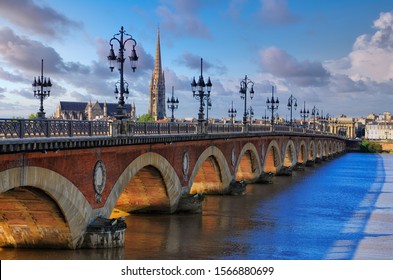 Scenic view of Bordeaux river bridge with St Michel cathedral and beautiful sky, Bordeaux, France