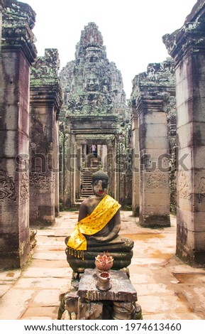 A scenic view of the Buddha statue at Bayon temple in Angkor, Cambodia