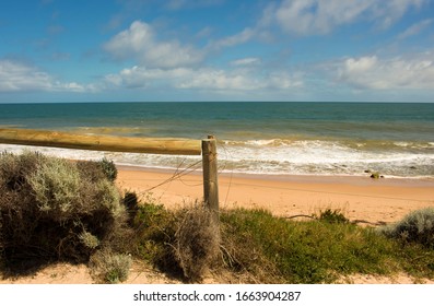 Scenic view of the calm Indian Ocean waves breaking on the sandy shore at Ocean Beach Bunbury Western Australia on a fine cloudy afternoon in late autumn creates a splendid sea scape. - Shutterstock ID 1663904287