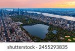 Scenic view of Central Park in the cityscape of New York, the USA. Aerial perspective. Enormous city panorama at sunset.