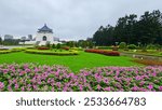 A scenic view of the Chiang Kai-shek Memorial Hall with colorful gardens in Taipei, Taiwan