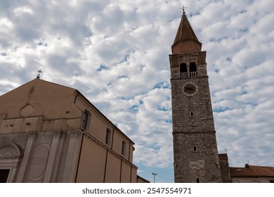 Scenic view of Church of the Assumption of the Blessed Virgin Mary in coastal town Umag, Istria peninsula, Croatia, Europe. Religious landmark. Tranquil serene atmosphere. Dramatic sky with clouds - Powered by Shutterstock