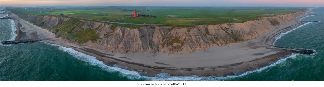 Scenic View Of The Cliffs At The Danish Coast With The Red Lighthouse Bovbjerg Fyr.  Panoramic Aerial View Of  Beautiful Nature Landscape Danish North Sea Coast, Jutland, Denmark, Europe.