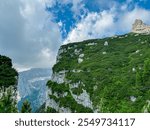 Scenic view of cloud covered rugged mountain peak of Croz dell