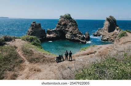 Scenic view of a coastal cliff with rock formations and turquoise waters, a perfect spot for nature lovers. - Powered by Shutterstock