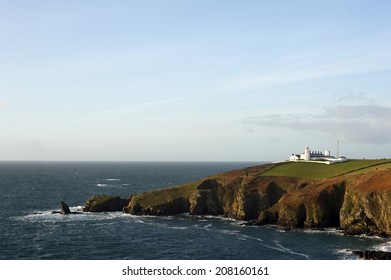 Scenic view of the coastline at Lizard Point, Lizard Peninsula, Cornwall with its historic lighthouse which marks the southernmost point in England overlooking the English Channel