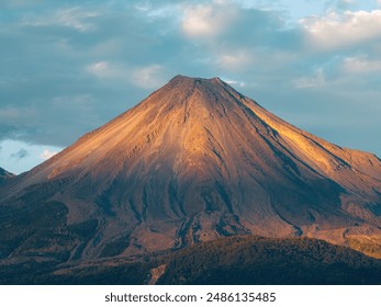 A scenic view of Colima's Volcano in Mexico at sunset - Powered by Shutterstock