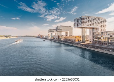 Scenic view of a Cologne cityscape skyline with Rhine river and modern residential buildings