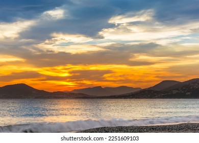 Scenic view of colorful sunset at the beach in Cote d'Azur France - Powered by Shutterstock