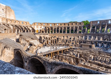 A scenic view of the Colosseum in Rome, Italy, during sunset. The ancient amphitheater is bathed in golden light, with crowds of people enjoying the warm evening. - Powered by Shutterstock