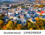 Scenic view from drone of historical center of Sumperk town in rays of autumn sun, Olomouc Region, Czech Republic