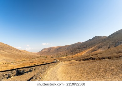 Scenic view of dry high valley between two mountain ranges - Shutterstock ID 2110922588
