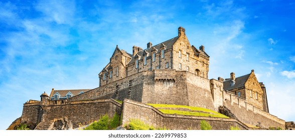 Scenic view of Edinburgh Castle over blue sky, Scotland. Edinburgh Castle is one of the most popular tourist attractions in Edinburgh city. - Shutterstock ID 2269979853