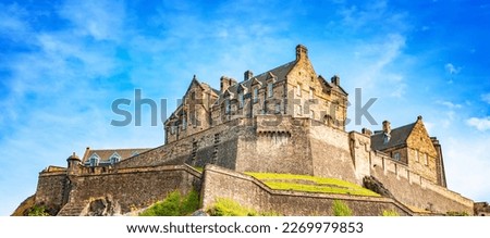 Scenic view of Edinburgh Castle over blue sky, Scotland. Edinburgh Castle is one of the most popular tourist attractions in Edinburgh city.