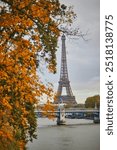 Scenic view to the Eiffel tower over the river Seine on a nice autumn day in Paris.