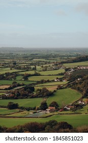 Scenic view of fields and farms from Mendip Hills, UK, on a sunny autumn day.