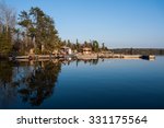 Scenic view of fishermen houses along shore of a lake in Kenora, Ontario