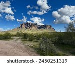 A scenic view of Flatiron in the Superstition mountains in the Lost Dutchman State Park in Apache junction near Phoenix, Arizona with beautiful blue sky and copy space.