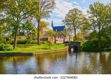 Scenic view of Grote of Sint-Laurenskerk cathedral in Alkmaar, the Netherlands - Shutterstock ID 2227606083