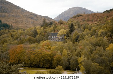 Scenic view of a historic house in the Scottish Highlands, surrounded by rugged landscapes, rolling hills, and dramatic skies. This picturesque property embodies the charm and mystery of Scotlands - Powered by Shutterstock