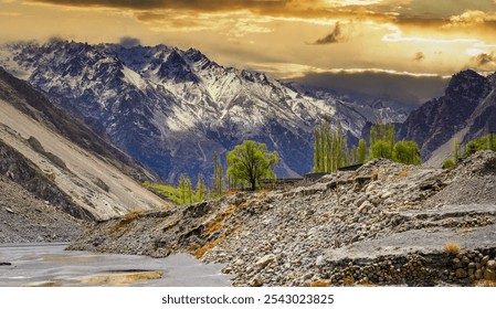 A scenic view in Hunza Valley, Pakistan, with rugged mountains, a serene riverbed, and a lone tree standing against a dramatic sunset, capturing the region’s raw beauty. - Powered by Shutterstock