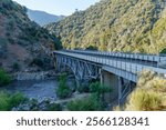 Scenic view of Johnsondale Bridge and mountains over Kern River in Camp Nelson, California