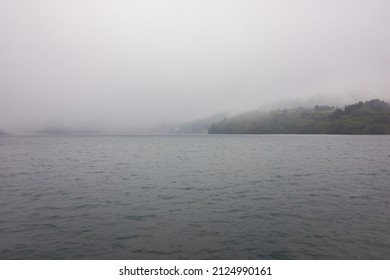 Scenic View Of Lake Ashi From Hakone Sightseeing Cruise Pirate Ship With Mountain And Fog And Cloudy Sky Background. No People.