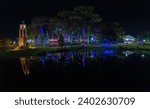 Scenic view of lake Mary and charming trees decorated with Christmas lights, Florida, USA