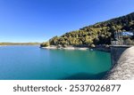 A scenic view of Lake Plastiras, an artificial lake fed by the Tavropos (Megdovas) River, located near the city of Karditsa, Greece. This popular resort offers serene natural beauty.