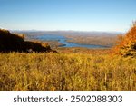 Scenic view of Lake Sunapee from the top of Mount Sunapee in Newbury, New Hampshire in autumn.