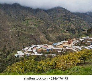 Scenic View Of Little  Mountain Village In The Peruvian Andes Against Cloudy Sky