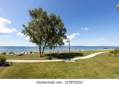 scenic view of little traverse bay and a sidewalk path at the inn at bay harbor - Shutterstock ID 2178753221