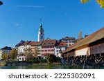 Scenic view of medieval old town of Swiss City of Olten, Canton Solothurn, with covered wooden bridge and Aare River on a sunny autumn afternoon. Photo taken November 10th, 2022, Olten, Switzerland.