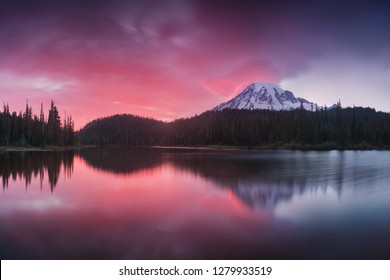 
Scenic view of Mount Rainier reflected across the reflection lakes.. Pink sunset light on Mount Rainier in the Cascade Range, Washington State. Beautiful Paradise area - Powered by Shutterstock