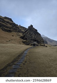 Scenic view of the mountain and path to Rutshellir Caves, Iceland