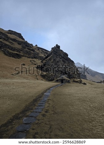 Scenic view of the mountain and path to Rutshellir Caves, Iceland