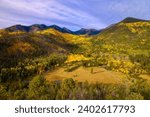 A scenic view of a mountain range covered with vibrant autumn woods. Lockett Meadow, Arizona