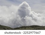 Scenic view of mountains in Central Java Indonesia with dramatic clouds in dark sky background. No people.