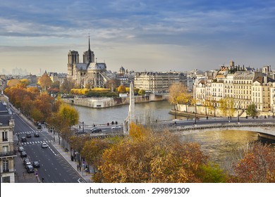 Scenic view of Notre-Dame de Paris with Saint-Louis and Cite islands on a bright fall day