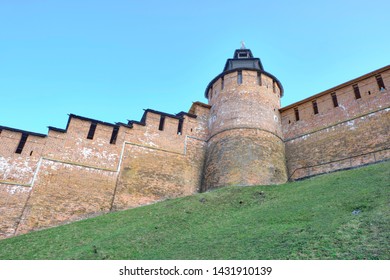 Scenic View Of Old Wall Of Kremlin In Historic Center Of Nizhniy Novgorod. Beautiful Sunny Summer Look Of Wall With Towers Of Red Bricks In Ancient Touristic City In Russian Federation