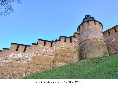 Scenic View Of Old Wall Of Kremlin In Historic Center Of Nizhniy Novgorod. Beautiful Sunny Summer Look Of Wall With Towers Of Red Bricks In Ancient Touristic City In Russian Federation