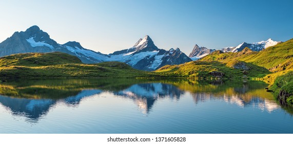Scenic view on Bernese range above Bachalpsee lake. Popular peaks Eiger, Jungfrau and Faulhorn. Switzerland alps, Grindelwald valley