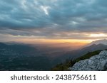 Scenic view from on top of mount Kula near Omis, Dinara mountains, Split-Dalmatia, Croatia, Europe. Looking at idyllic mountain ranges and soft hills of Dinaric Alps. Dramatic sky during vivid sunrise