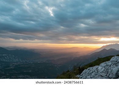 Scenic view from on top of mount Kula near Omis, Dinara mountains, Split-Dalmatia, Croatia, Europe. Looking at idyllic mountain ranges and soft hills of Dinaric Alps. Dramatic sky during vivid sunrise - Powered by Shutterstock