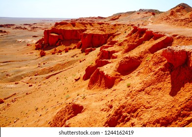 Scenic view over Flaming Cliffs or Bayanzag, where first dinosaur’s eggs were discovered, Gobi Desert, Mongolia, East Asia