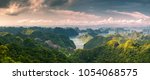 scenic view over Ha Long bay from Cat Ba island, Ha Long city in the background, UNESCO world heritage site, Vietnam