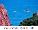 Scenic view of the Princess Castle on the southern coast of Paraíba, Brazil. Dreamy landscape with lush greenery, calm waters, and clear skies. Perfect for travel and historic themes.