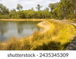 Scenic view of the reflective wetlands and lake at Dalyellup near Bunbury Western Australia which is home to ducks, coots and many other water birds on a fine, though cool morning in late summer.